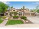 Expansive home with manicured front lawn, mature palms, and neutral color scheme at 2024 E Taurus Pl, Chandler, AZ 85249