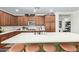 Spacious kitchen featuring a large island with seating and a built in sink at 2024 E Taurus Pl, Chandler, AZ 85249