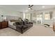Relaxing main bedroom with a seating area, ceiling fan, and access to the backyard at 2024 E Taurus Pl, Chandler, AZ 85249