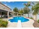 Beautiful backyard with pool, patio, diving board, mature landscaping, and shaded seating areas at 2024 E Taurus Pl, Chandler, AZ 85249