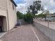Residential backyard with gravel landscaping and block perimeter wall at 22074 S 211Th St, Queen Creek, AZ 85142