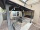 Cozy backyard patio featuring comfortable seating and ambient lighting at 22074 S 211Th St, Queen Creek, AZ 85142