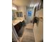Bathroom featuring a shower-tub combo, neutral tiling, a vanity with a sink, and ample countertop space at 22074 S 211Th St, Queen Creek, AZ 85142
