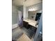 Bathroom featuring a shower-tub combo, neutral tiling, a vanity with a sink, and ample countertop space at 22074 S 211Th St, Queen Creek, AZ 85142