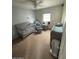 Bedroom with a crib, rocking chair, changing table, and neutral decor at 22074 S 211Th St, Queen Creek, AZ 85142
