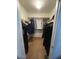 Organized walk-in closet offers ample storage and organization, complete with hanging racks for clothes and accessories at 22074 S 211Th St, Queen Creek, AZ 85142