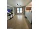 Open dining area featuring tile flooring and a bar with bar stools at 22074 S 211Th St, Queen Creek, AZ 85142