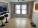 Open dining area featuring tile flooring and a bar with bar stools at 22074 S 211Th St, Queen Creek, AZ 85142