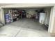Spacious garage with storage shelves and ample room for vehicles and projects at 22074 S 211Th St, Queen Creek, AZ 85142