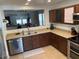 Functional kitchen with stainless steel appliances, solid surface counters and tile flooring at 22074 S 211Th St, Queen Creek, AZ 85142
