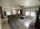 Cozy living room featuring a sectional sofa and a large TV at 22074 S 211Th St, Queen Creek, AZ 85142