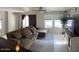 Spacious living room featuring a large sectional sofa and contemporary décor at 22074 S 211Th St, Queen Creek, AZ 85142