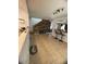 Open floor plan living area with tile flooring and wood accent wall at 22074 S 211Th St, Queen Creek, AZ 85142