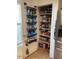 Walk-in pantry filled with shelving units and assorted food items at 22074 S 211Th St, Queen Creek, AZ 85142