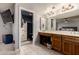Bright bathroom with a double sink vanity, tiled floor, and shower at 2324 E Cortez St, Phoenix, AZ 85028