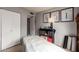Well-lit bedroom featuring a massage table and storage furniture, offering a serene and functional space at 2324 E Cortez St, Phoenix, AZ 85028