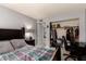 Inviting bedroom featuring a bed, desk, and walk-in closet, providing ample space and convenience at 2324 E Cortez St, Phoenix, AZ 85028