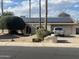 Charming single-story home featuring solar panels and a well-manicured front yard at 2324 E Cortez St, Phoenix, AZ 85028