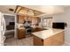 Well-designed kitchen offering stainless steel appliances, a kitchen island, and convenient access to outdoor living spaces at 2324 E Cortez St, Phoenix, AZ 85028