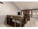 Cozy living room featuring a custom dog kennel and a comfortable seating area by the fireplace at 2324 E Cortez St, Phoenix, AZ 85028