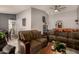 Open living area with a comfortable sofa, bar counter, and view into the dining area at 2324 E Cortez St, Phoenix, AZ 85028