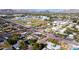 Expansive aerial view showcasing a neighborhood with sports fields and a mix of residential and commercial properties at 2546 E Roma Ave, Phoenix, AZ 85016