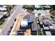 Aerial view reveals the completed roof of a house under construction with scattered building materials at 2546 E Roma Ave, Phoenix, AZ 85016