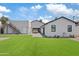 Spacious backyard with artificial turf, modern patio, and well-maintained landscaping at 2546 E Roma Ave, Phoenix, AZ 85016