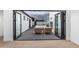 Outdoor patio area with seating, accessible through folding glass doors at 2546 E Roma Ave, Phoenix, AZ 85016