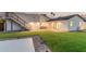 Spacious backyard featuring artificial grass, modern lighting, and an outdoor staircase at 2546 E Roma Ave, Phoenix, AZ 85016