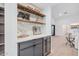 Contemporary bar area with open shelving and beverage cooler at 2546 E Roma Ave, Phoenix, AZ 85016