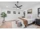 Comfortable bedroom with a ceiling fan, neutral tones, and plush accents at 2546 E Roma Ave, Phoenix, AZ 85016