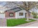 Attractive home with modern landscaping, contrasting brick, desert accents, and meticulously maintained front yard at 2546 E Roma Ave, Phoenix, AZ 85016