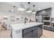 Stylish kitchen with a large island, stainless steel appliances, and open layout to the living area at 2546 E Roma Ave, Phoenix, AZ 85016
