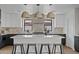 Modern kitchen features a large island with seating, pendant lighting, and contemporary cabinetry and countertops at 2546 E Roma Ave, Phoenix, AZ 85016