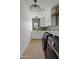 Efficient laundry room features modern appliances, stylish cabinets, and decorative lighting at 2546 E Roma Ave, Phoenix, AZ 85016