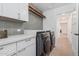 Laundry room with modern washer and dryer and ample counter space at 2546 E Roma Ave, Phoenix, AZ 85016