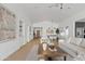 Bright, open-concept living room features a vaulted ceiling, stylish decor, and seamless flow to dining and kitchen areas at 2546 E Roma Ave, Phoenix, AZ 85016