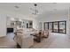 Bright and airy living room with open floor plan, modern lighting, and seamless indoor-outdoor transition at 2546 E Roma Ave, Phoenix, AZ 85016