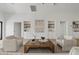 Spacious living room features built-in shelving, stylish decor, and wood flooring at 2546 E Roma Ave, Phoenix, AZ 85016