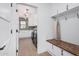 Well-organized mud room with bench, hooks, and access to the laundry area at 2546 E Roma Ave, Phoenix, AZ 85016