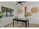 Bright office featuring a modern desk, stylish decor, and views of the outdoors at 2546 E Roma Ave, Phoenix, AZ 85016