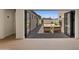Covered patio with an inviting outdoor seating area accessible through folding glass doors at 2546 E Roma Ave, Phoenix, AZ 85016