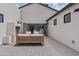 Outdoor living space with an outdoor fireplace, comfortable seating, and seamless access to the indoors at 2546 E Roma Ave, Phoenix, AZ 85016