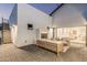 Inviting outdoor patio with a cozy fireplace, stylish furniture, and modern design at 2546 E Roma Ave, Phoenix, AZ 85016