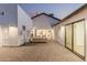 Stunning patio with a fireplace, comfortable seating, and a seamless connection to the indoors at 2546 E Roma Ave, Phoenix, AZ 85016