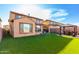 Expansive view of backyard, with synthetic grass, patio, gazebo and hardscape pavers at 25627 N 163Rd Dr, Surprise, AZ 85387