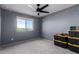 This bedroom has great natural light from its window, plush carpeting, and ample room for personalization at 25627 N 163Rd Dr, Surprise, AZ 85387
