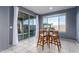 Dining area with table set for four and view to the backyard with patio at 25627 N 163Rd Dr, Surprise, AZ 85387