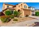 Two-story home featuring a lovely landscaped yard, covered entry, and two-car garage at 25627 N 163Rd Dr, Surprise, AZ 85387